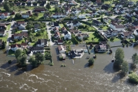 Deler av Hønefoss ble også oversvømt under flommen. Ringerike er blant kommunene som nå får utbetalt store beløp for å kompensere for skadene.